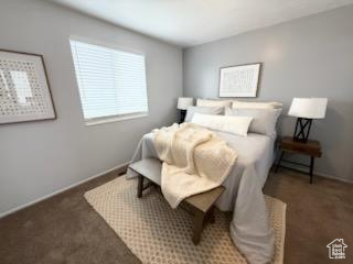 Carpeted bedroom featuring baseboards