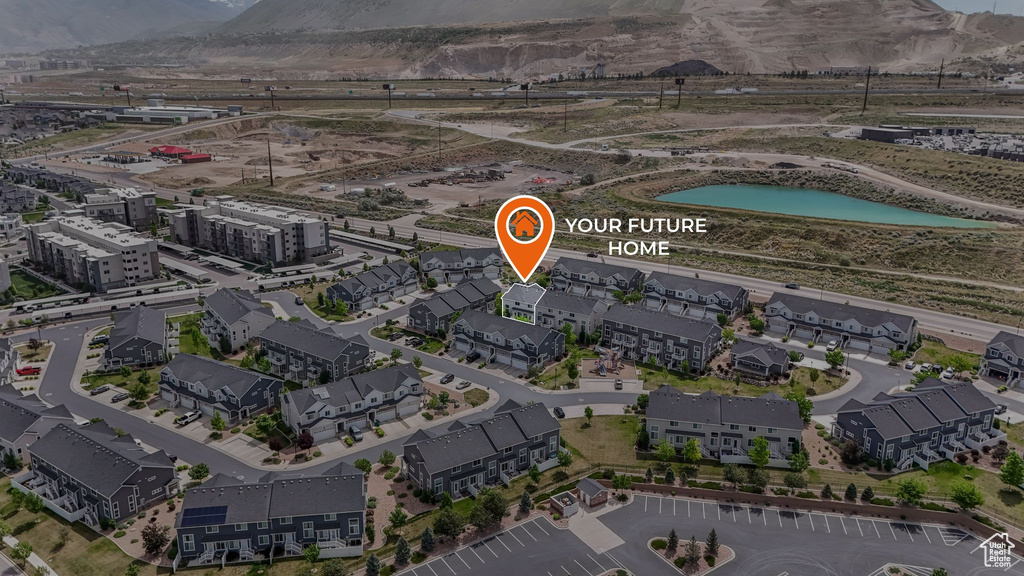 Aerial overview of property\'s location featuring a mountain backdrop