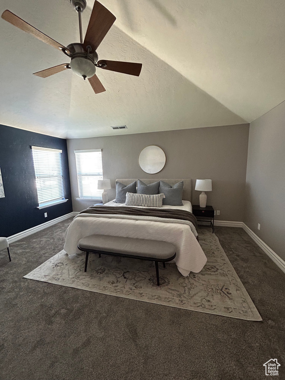 Carpeted bedroom with baseboards and ceiling fan