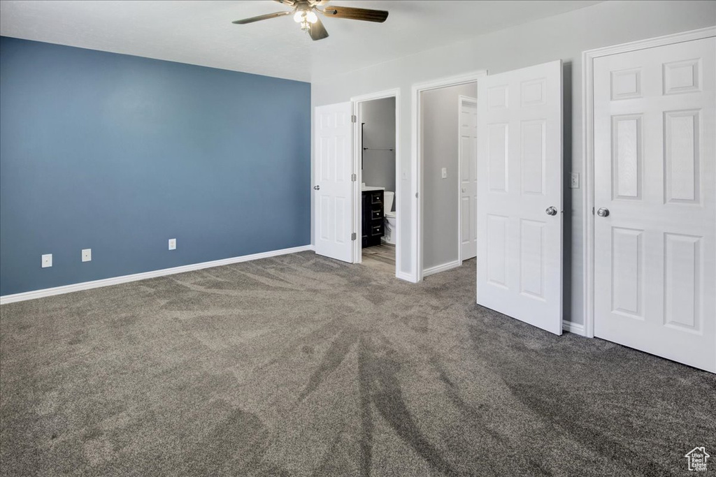 Unfurnished bedroom featuring carpet flooring, baseboards, and ceiling fan