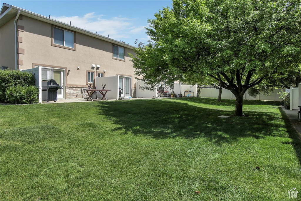 Rear view of property featuring stucco siding