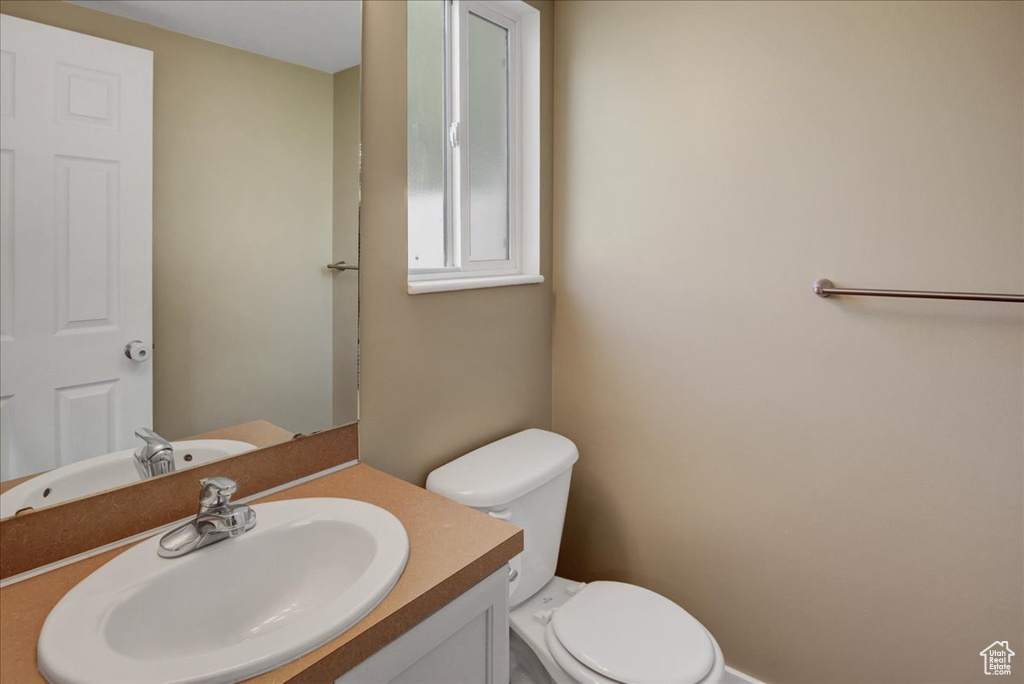 Half bath with toilet and vanity