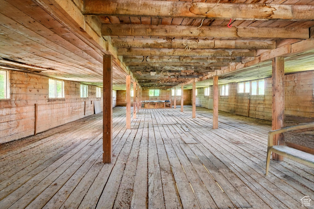 Basement with hardwood / wood-style flooring and wooden ceiling