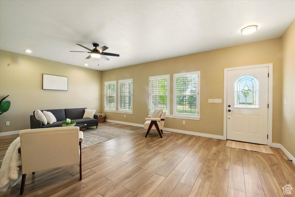 Entrance foyer featuring baseboards, light wood-style floors, ceiling fan, and recessed lighting