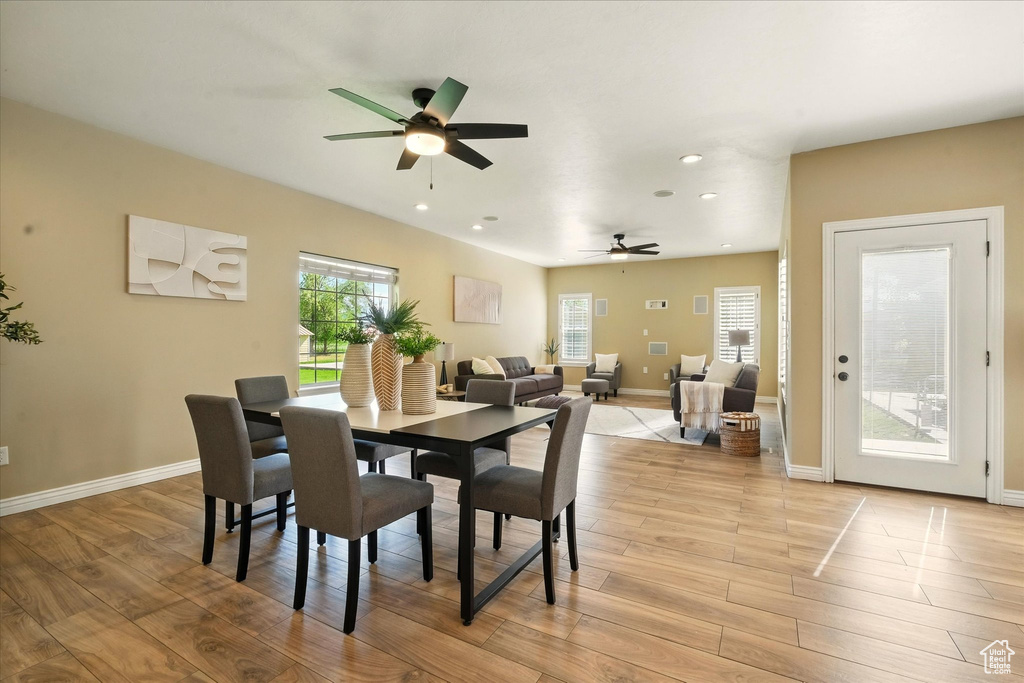 Dining area featuring ceiling fan, recessed lighting, light wood finished floors, and baseboards