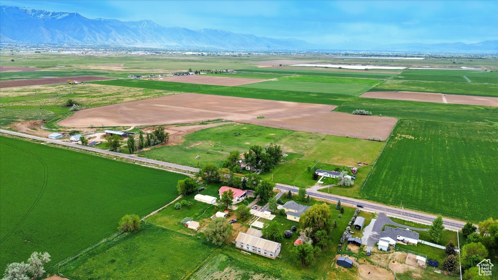 View of property location with rural landscape, mountains, and rows of crops