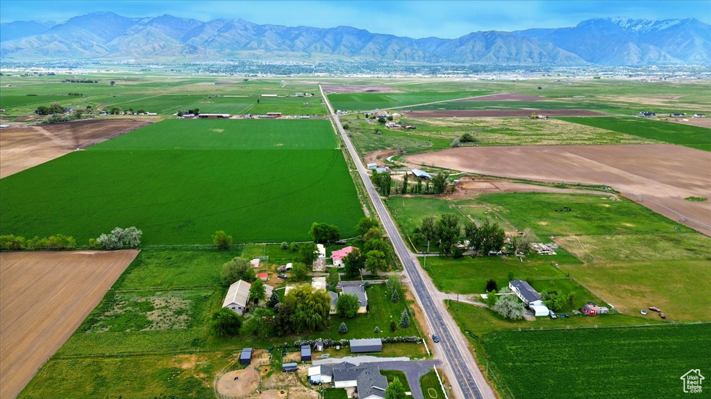 Overview of rural landscape featuring a mountainous background