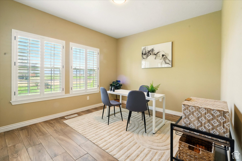 Office featuring baseboards and wood finished floors