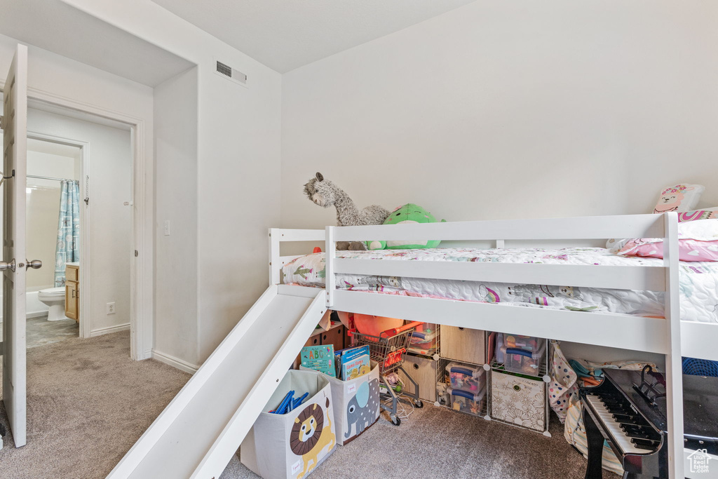 Bedroom with carpet flooring and baseboards