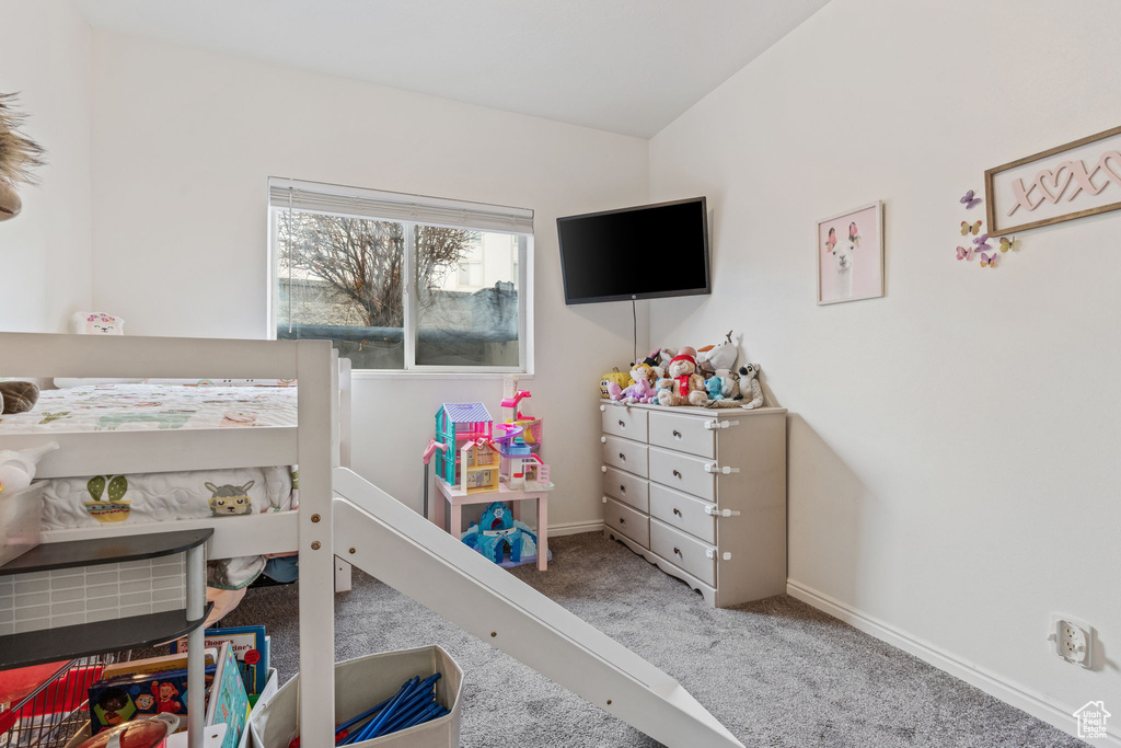 Carpeted bedroom featuring baseboards