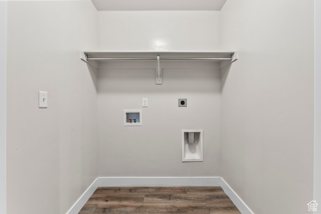 Laundry area with baseboards, hookup for an electric dryer, hookup for a washing machine, and dark wood-style floors