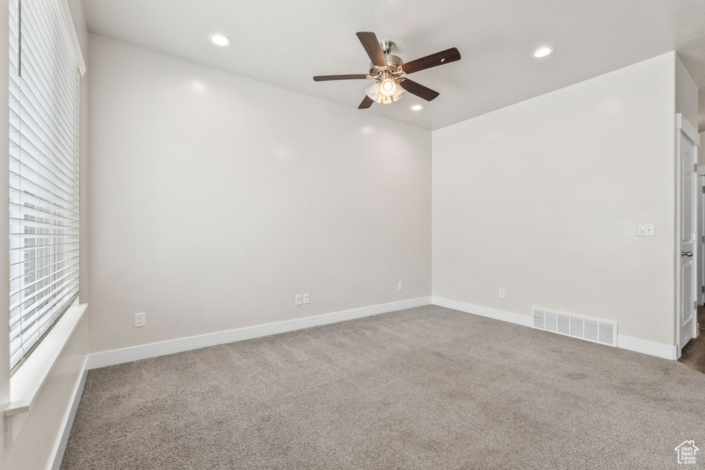 Empty room with a ceiling fan, carpet flooring, recessed lighting, and baseboards