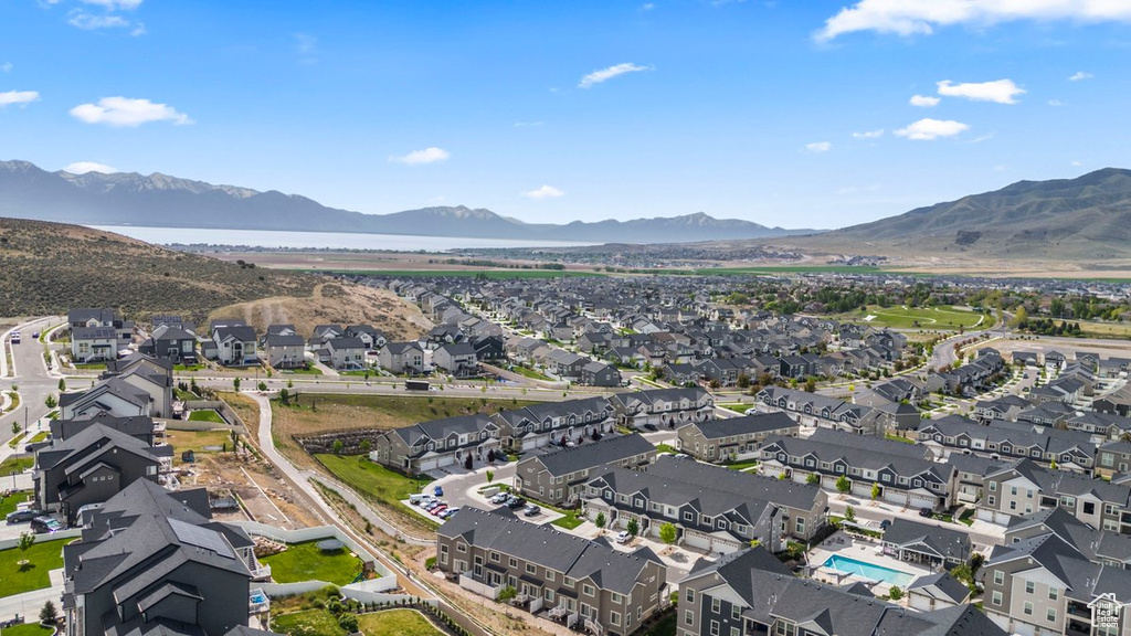 Aerial overview of property's location featuring nearby suburban area and mountains