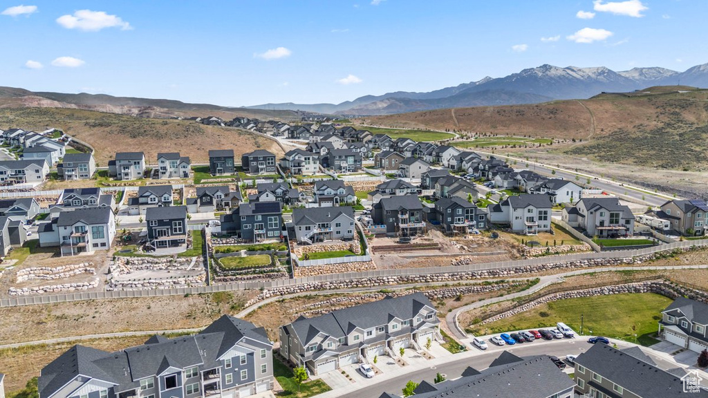 Aerial perspective of suburban area with a mountain backdrop