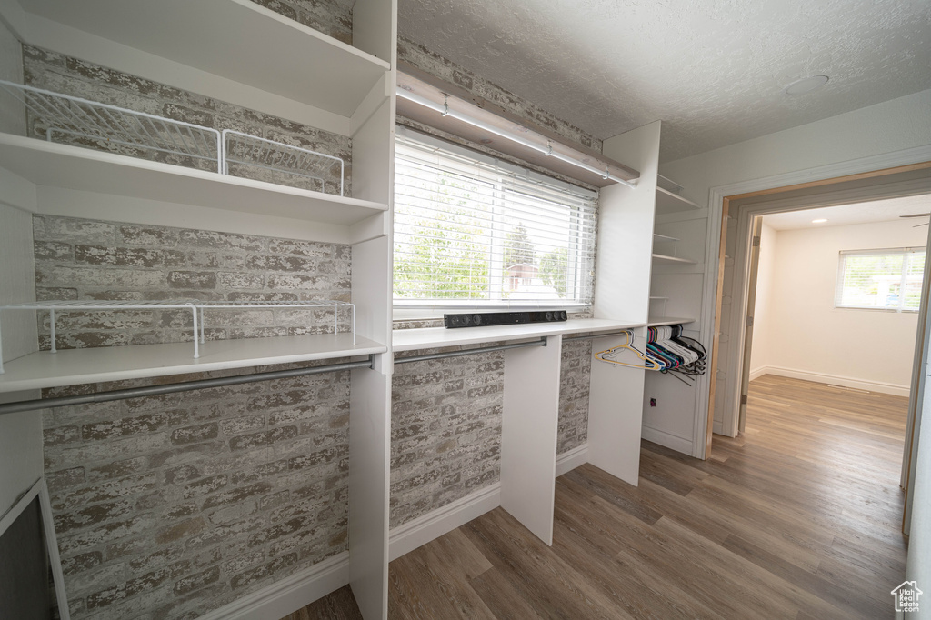 Spacious closet with wood finished floors