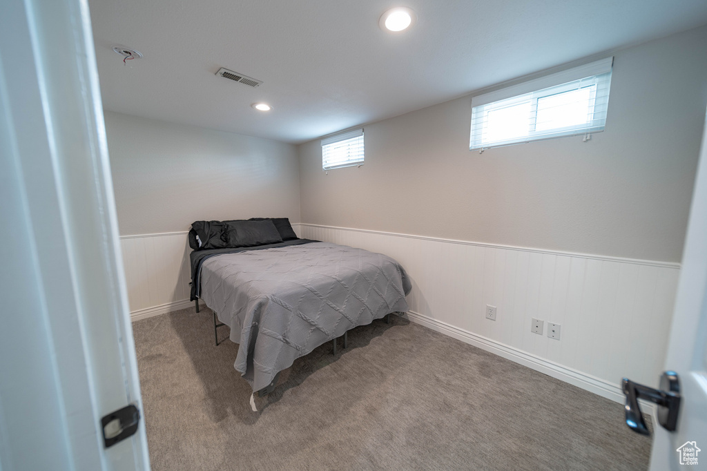 Bedroom with wainscoting, carpet flooring, and recessed lighting