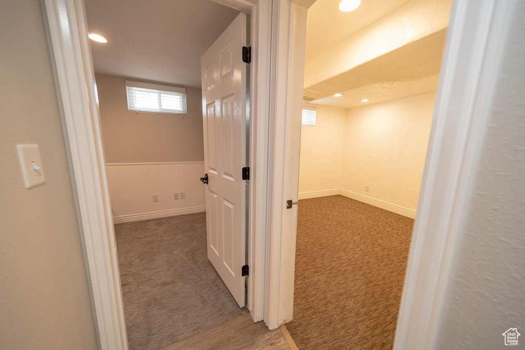 Hallway with carpet flooring and recessed lighting