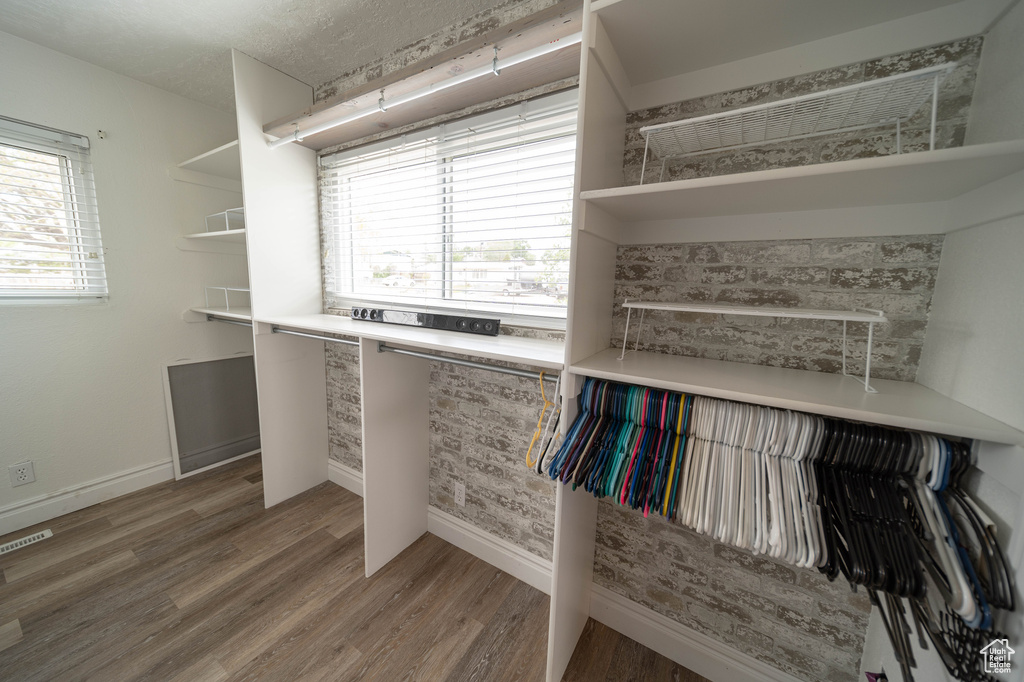 Spacious closet featuring light wood-type flooring