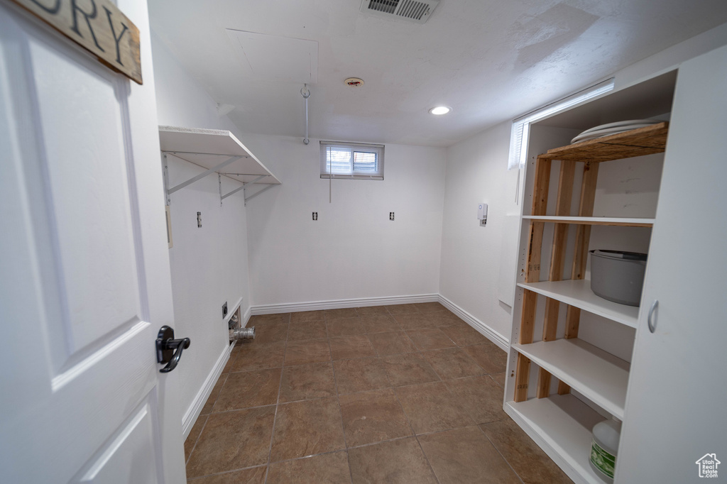 Laundry area with attic access, baseboards, and recessed lighting