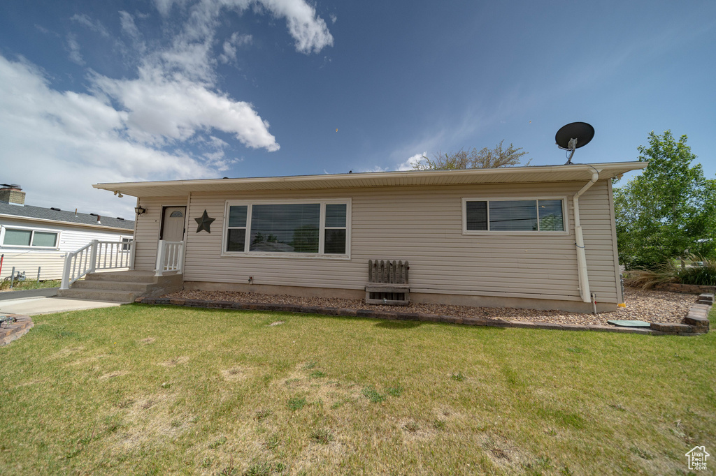 View of front of property with a front lawn