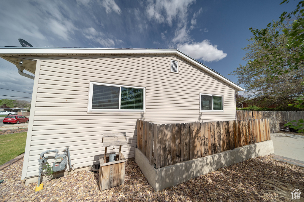 View of home\'s exterior featuring fence
