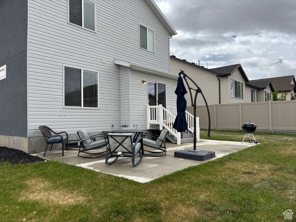 Back of property with a patio area
