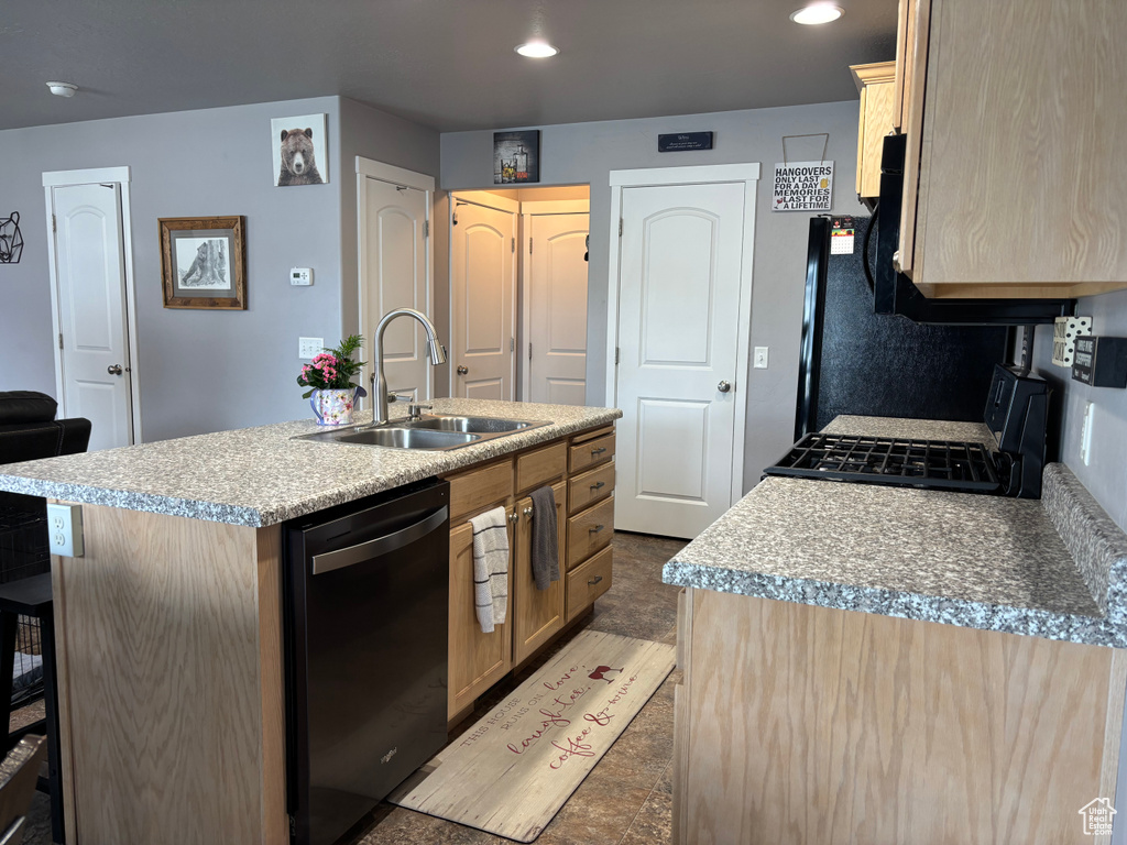 Kitchen featuring dishwasher, a sink, an island with sink, light countertops, and range with gas cooktop