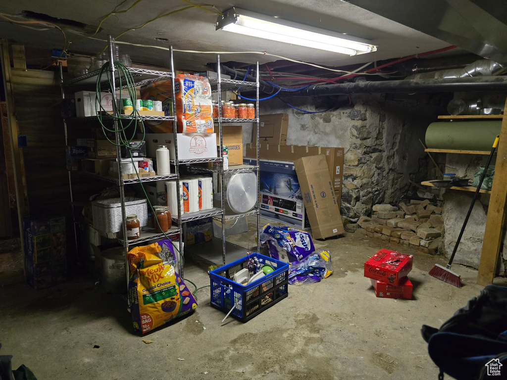 Unfinished below grade area featuring oil tank
