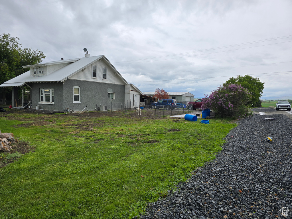 View of side of property with stucco siding