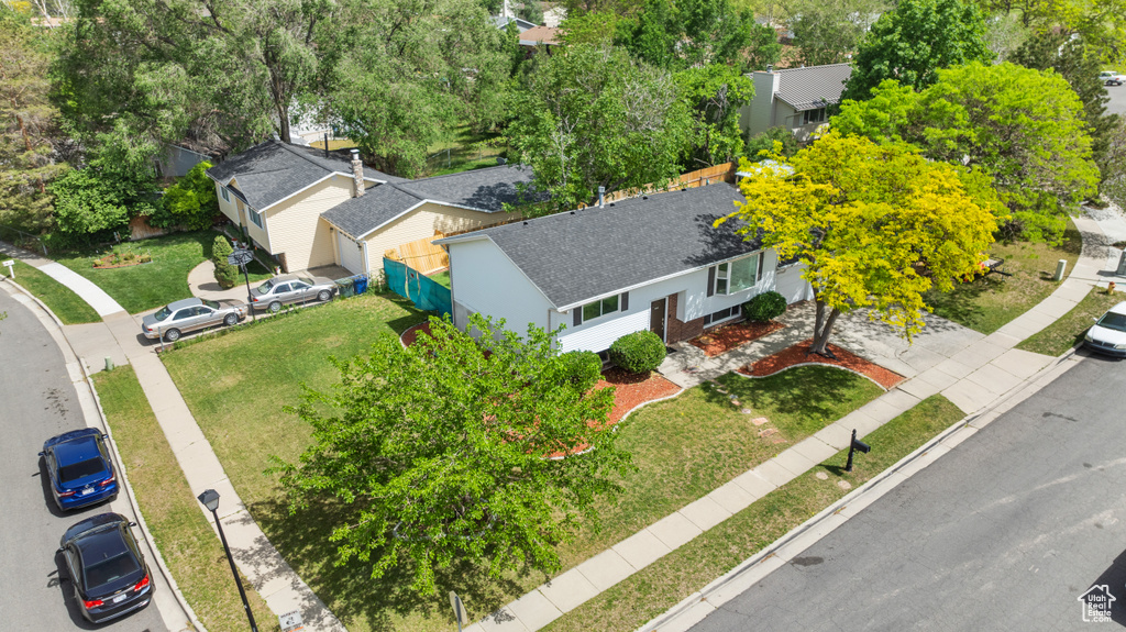 Aerial view of residential area with a tree filled landscape