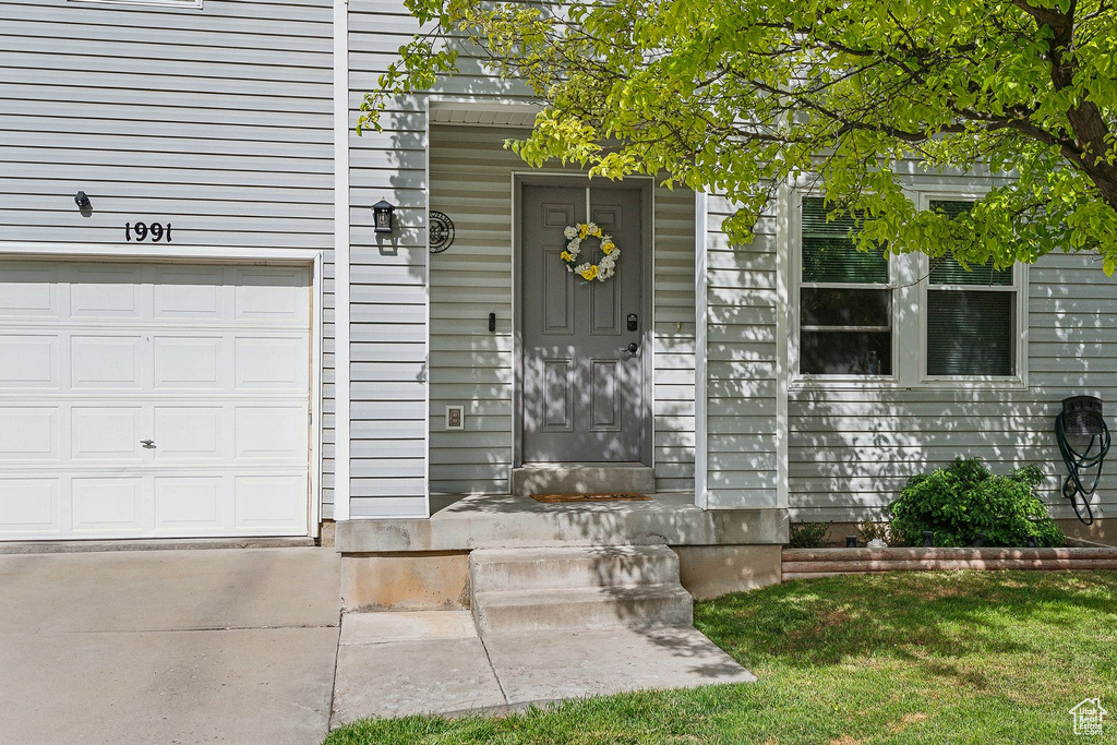Property entrance featuring a garage