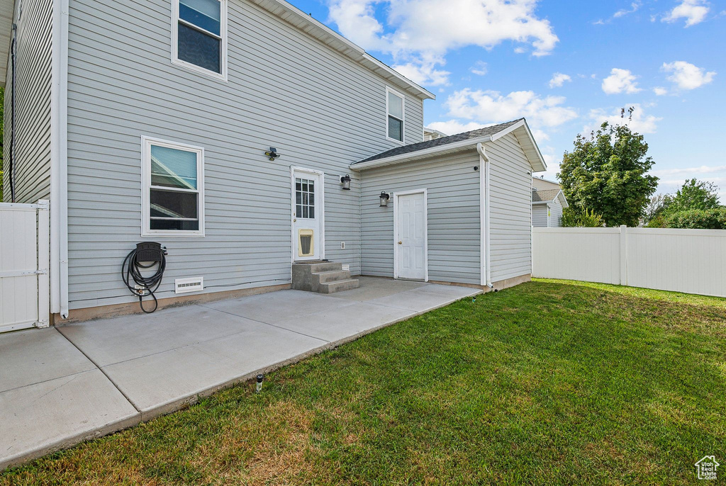 Rear view of property with a patio