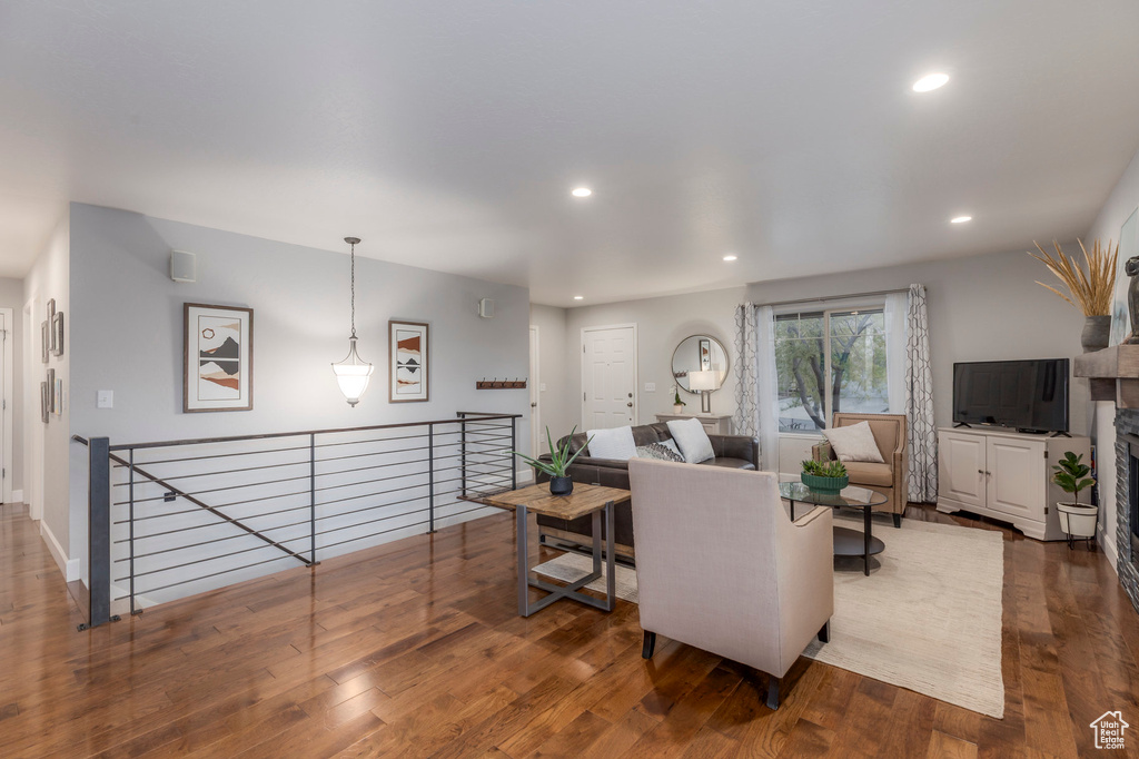 Living area featuring wood finished floors and recessed lighting