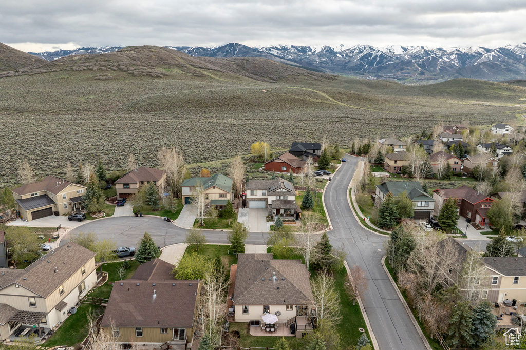 Aerial view of residential area with a mountainous background