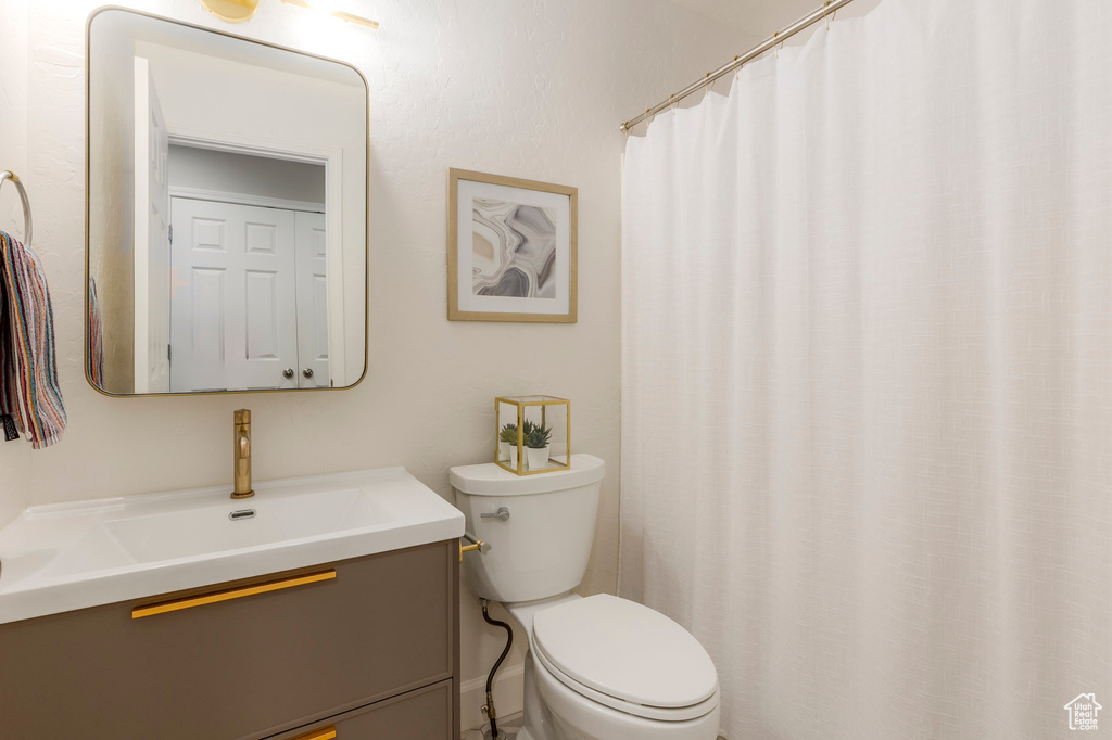Bathroom featuring toilet and vanity