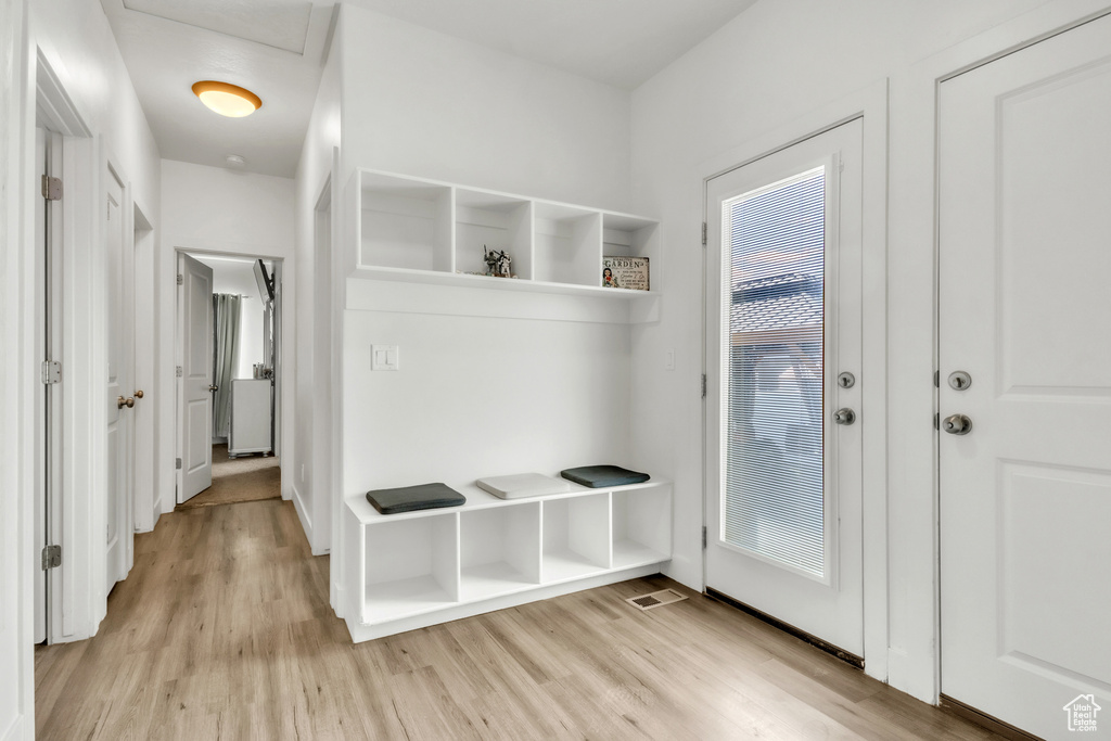 Mudroom with light wood-style floors