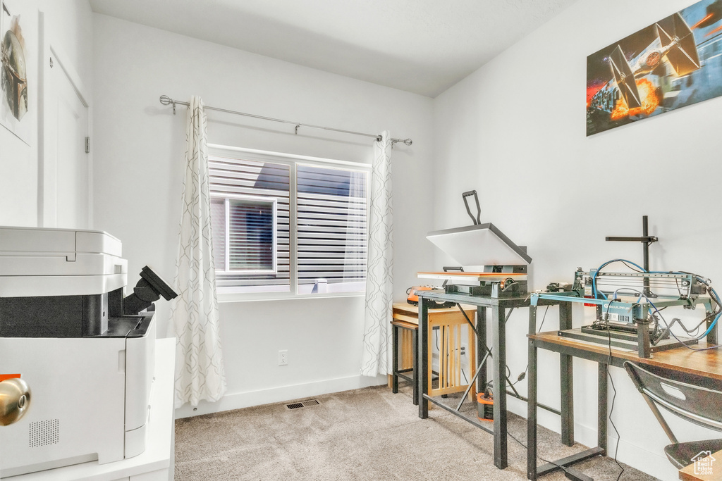 Rec room with carpet flooring, baseboards, and a desk