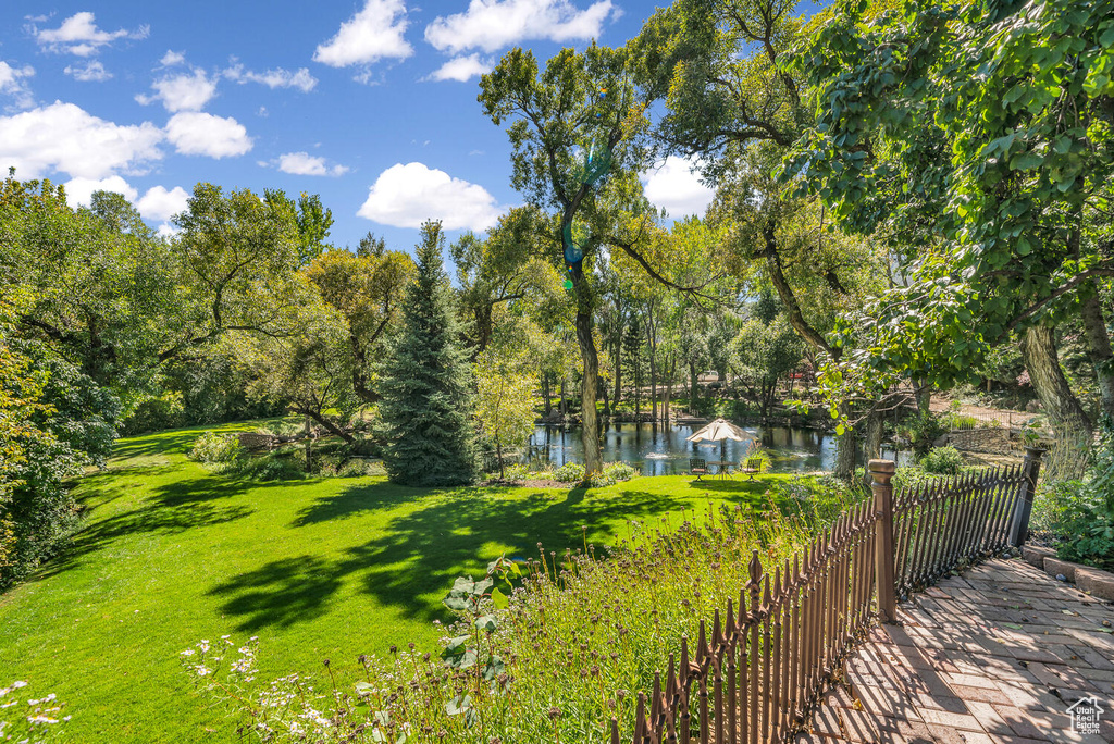 View of grassy yard featuring a water view