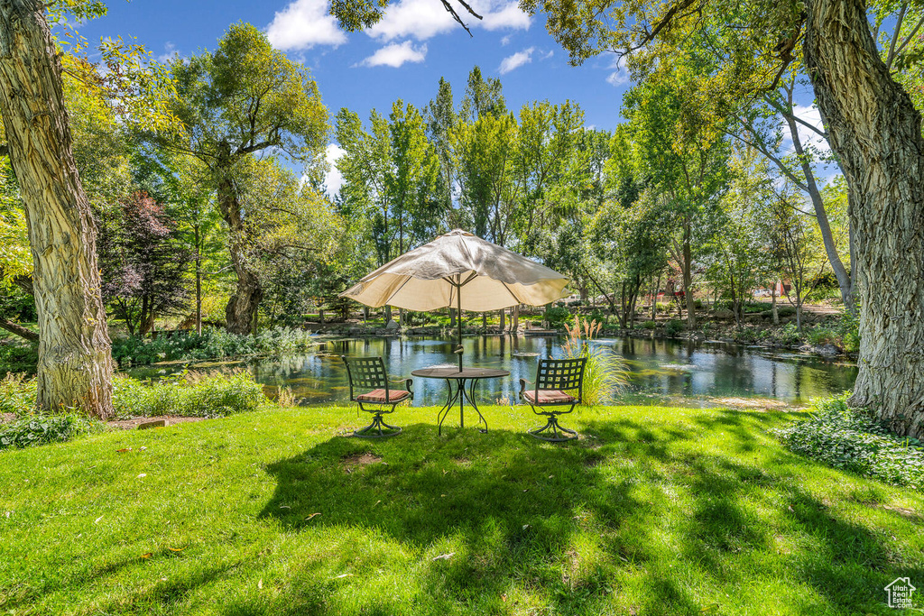 View of grassy yard featuring a water view