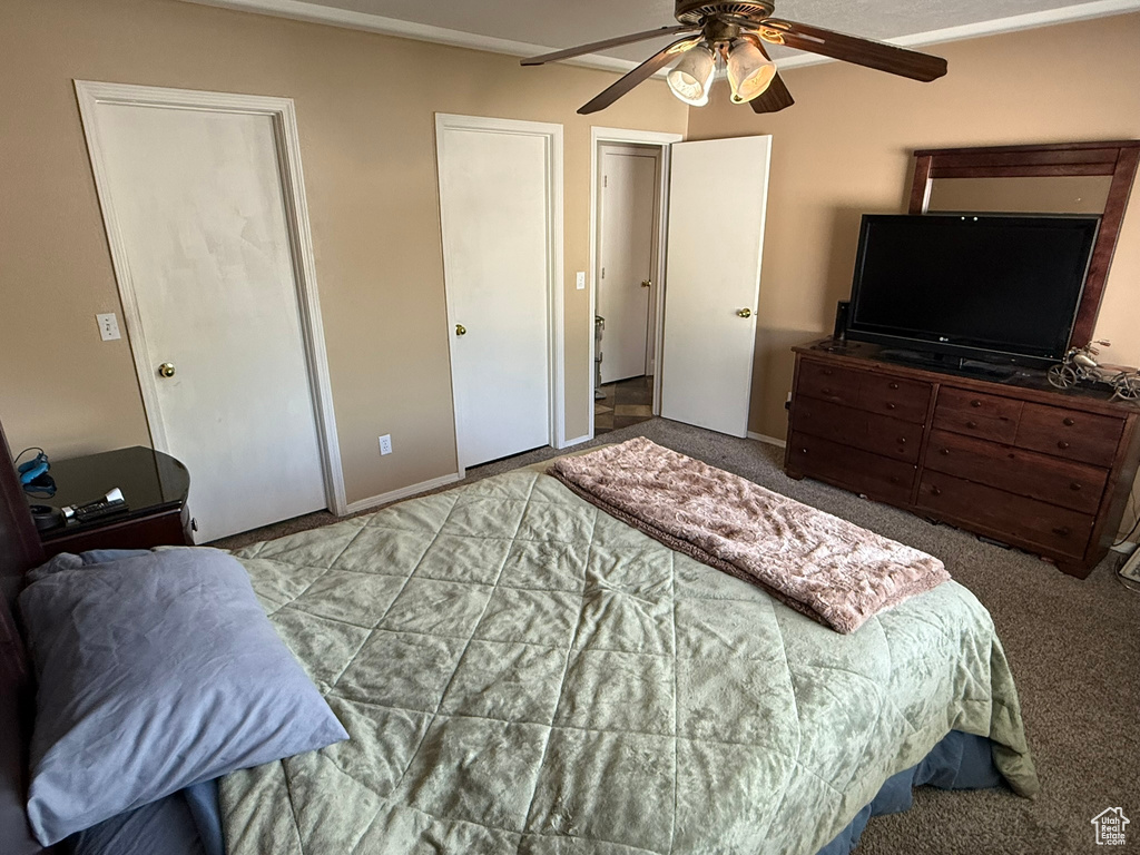 Bedroom with carpet flooring and ceiling fan