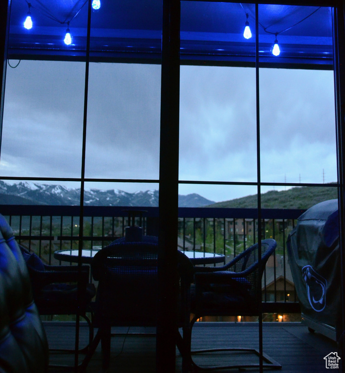 Sunroom / solarium with a mountain view