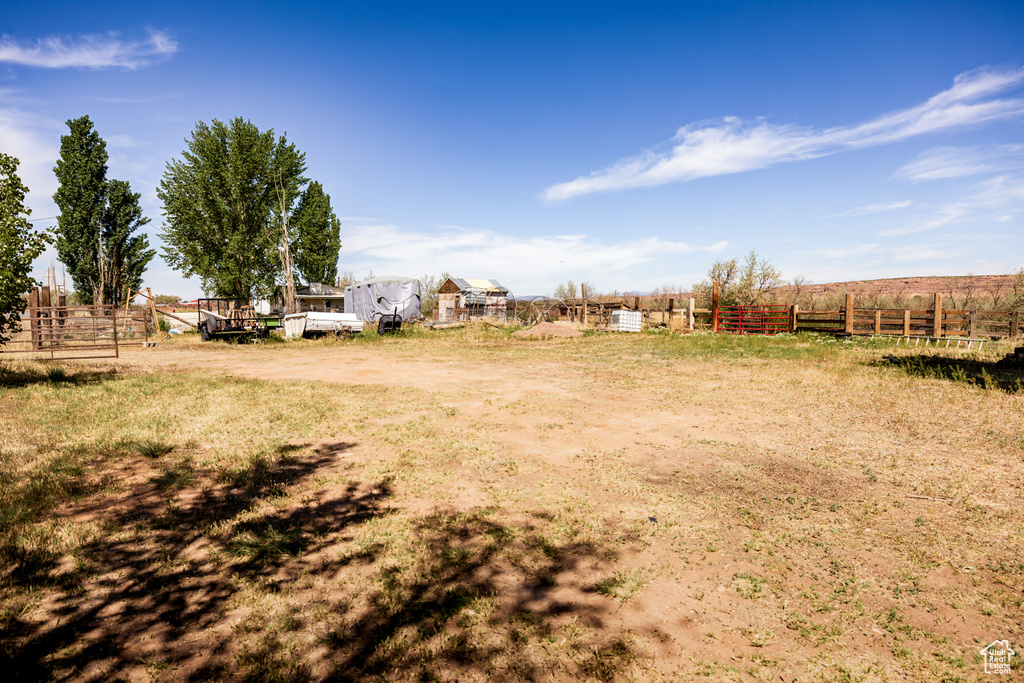 View of yard featuring fence and a view of countryside
