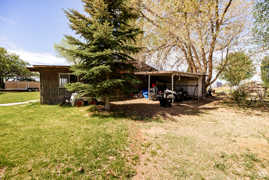 View of green lawn with an outbuilding