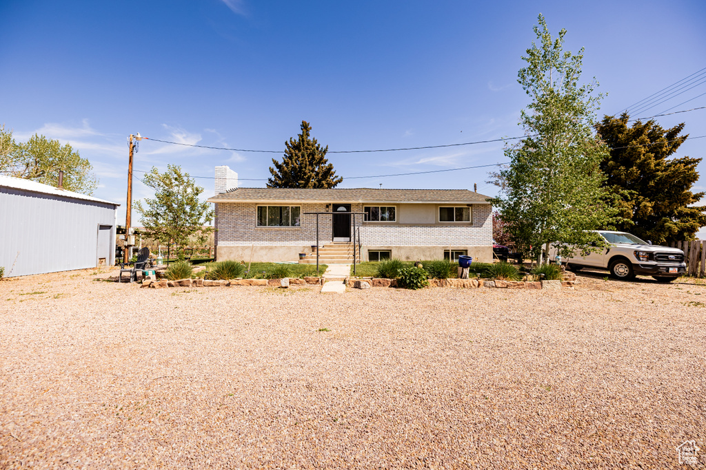 View of front of home featuring brick siding