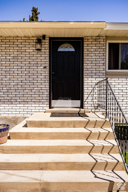 Property entrance with brick siding