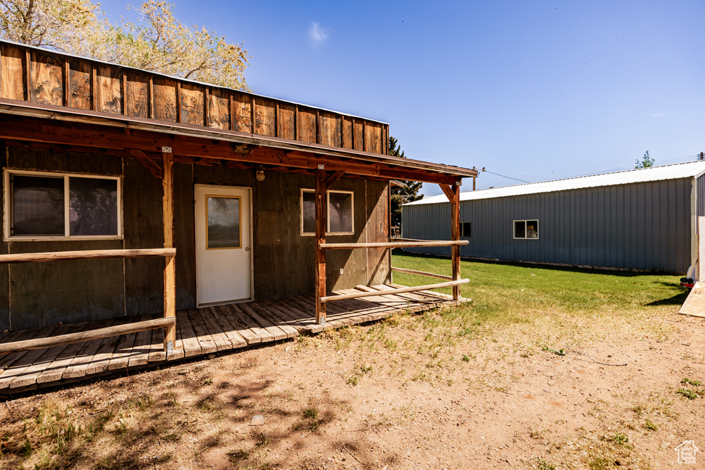 View of grassy yard with an outdoor structure