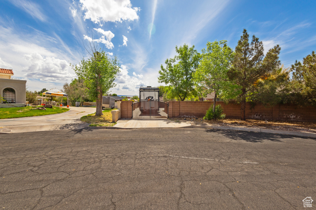 View of front of home featuring a gate and fence