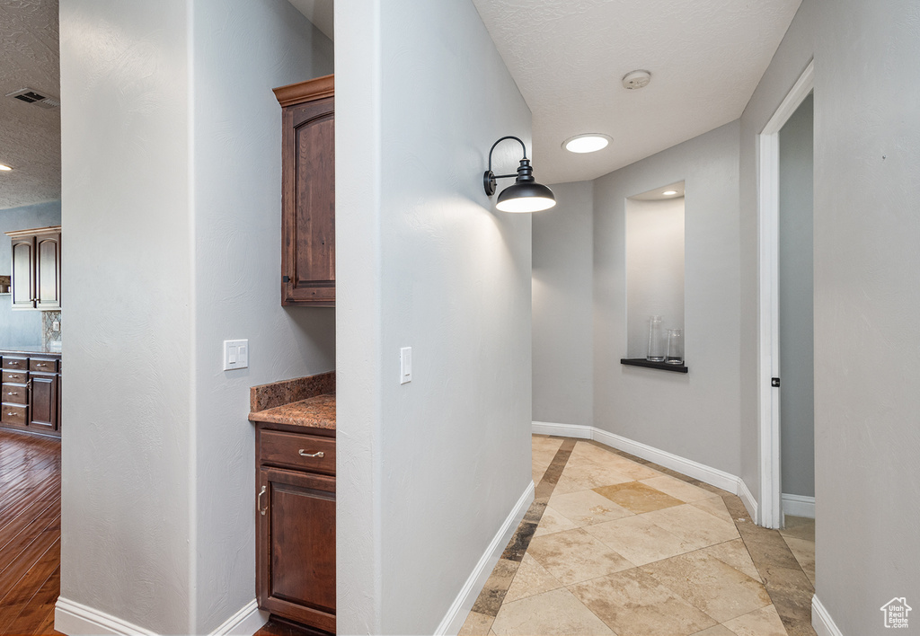 Hallway featuring baseboards and recessed lighting