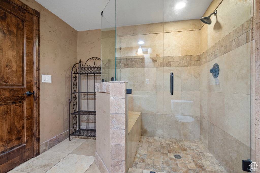 Bathroom featuring a shower stall