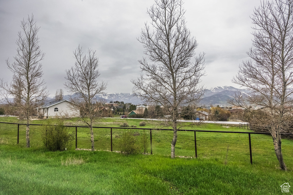 View of yard featuring a mountain view and a view of countryside